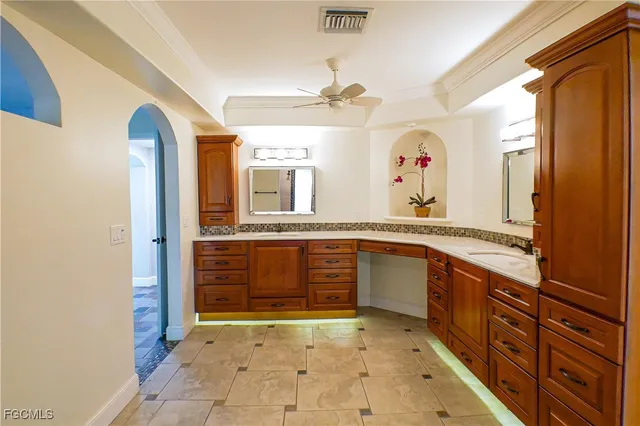 a large bathroom with a sink and a large mirror
