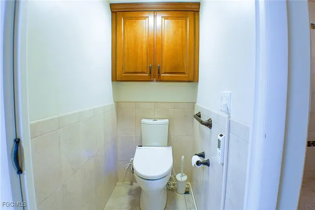 a bathroom with a toilet and a sink