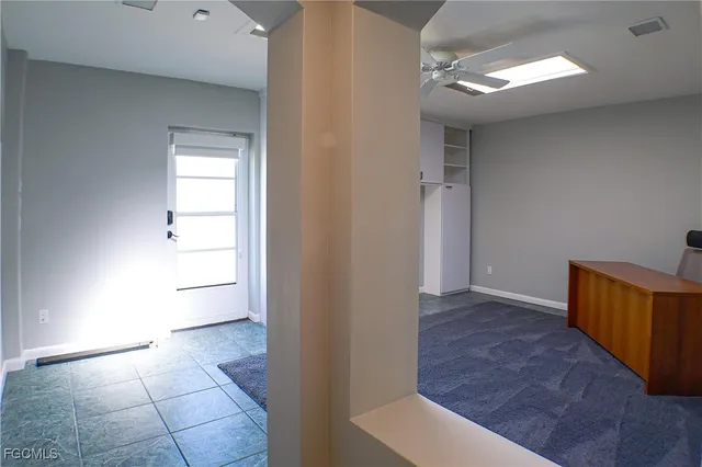 a view of a room with cabinet and window