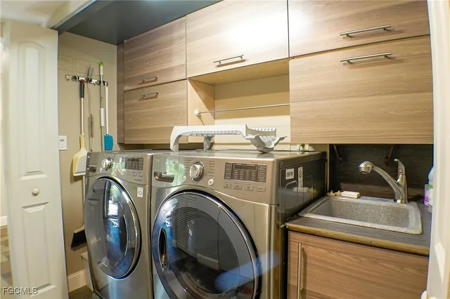 a view of a hallway with washer and dryer