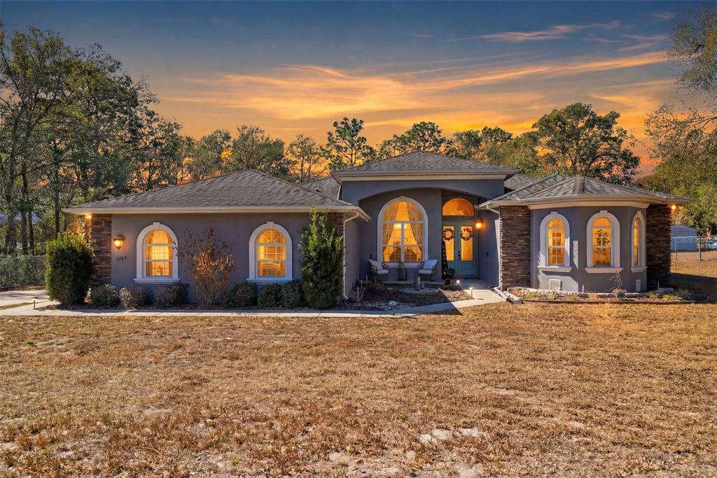 a front view of a house with yard