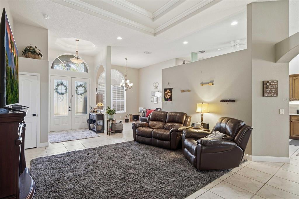 5580 South Kline Terrace Inverness, FL 34452 - Photo 12 of 55 a living room with furniture a clock and a fireplace