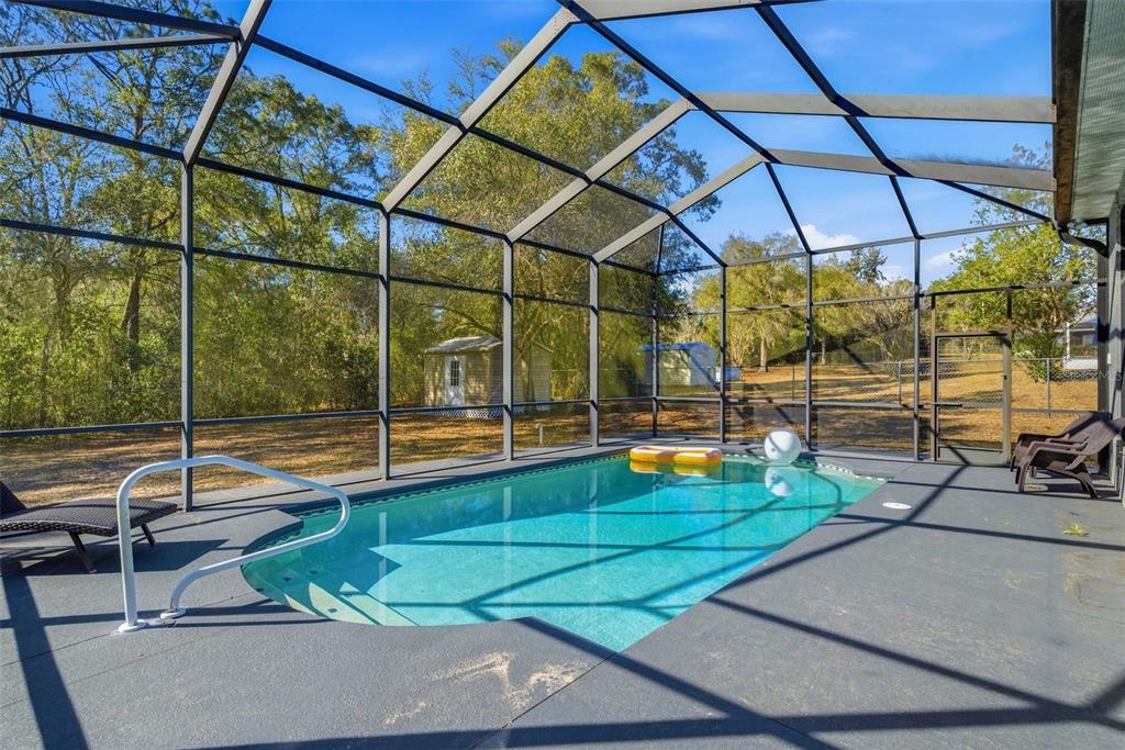 5580 South Kline Terrace Inverness, FL 34452 - Photo 20 of 55 a view of a swimming pool with a lounge chairs