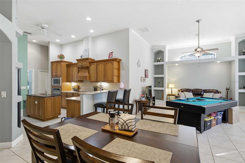5580 South Kline Terrace Inverness, FL 34452 - Photo 29 of 55 a living room with stainless steel appliances kitchen island granite countertop furniture and a dining table