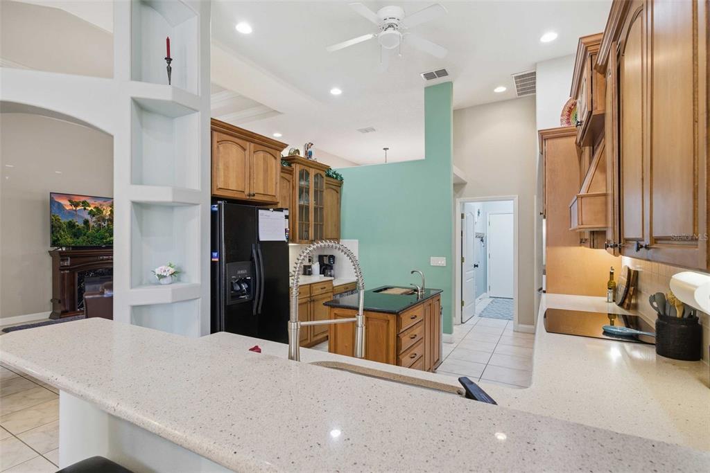 5580 South Kline Terrace Inverness, FL 34452 - Photo 33 of 55 a kitchen with stainless steel appliances kitchen island granite countertop a refrigerator and a sink
