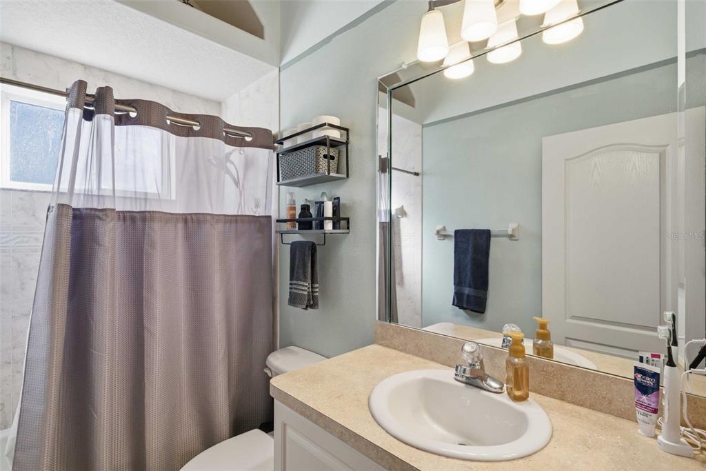 5580 South Kline Terrace Inverness, FL 34452 - Photo 46 of 55 a bathroom with a sink vanity mirror and toilet