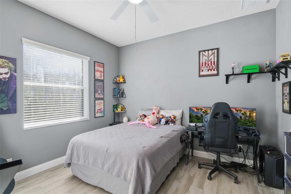 5580 South Kline Terrace Inverness, FL 34452 - Photo 47 of 55 a bedroom with a bed a desk chair and a window