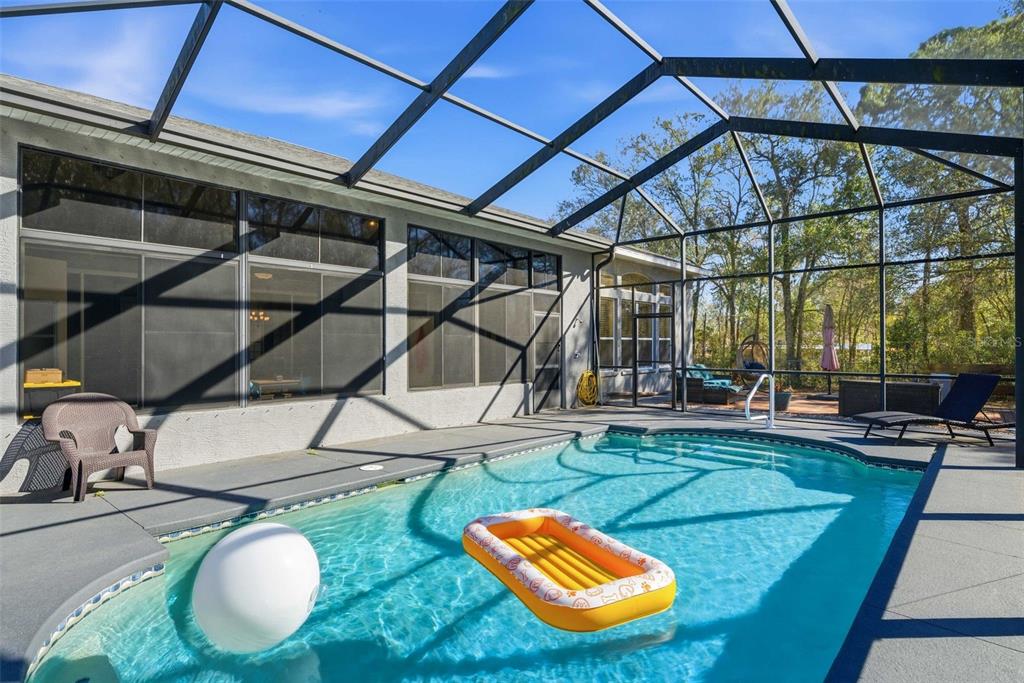 5580 South Kline Terrace Inverness, FL 34452 - Photo 6 of 55 a backyard of a house with table and chairs