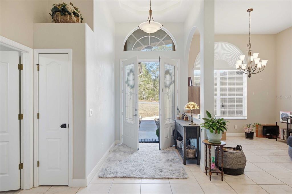 5580 South Kline Terrace Inverness, FL 34452 - Photo 7 of 55 a living room with furniture and a chandelier