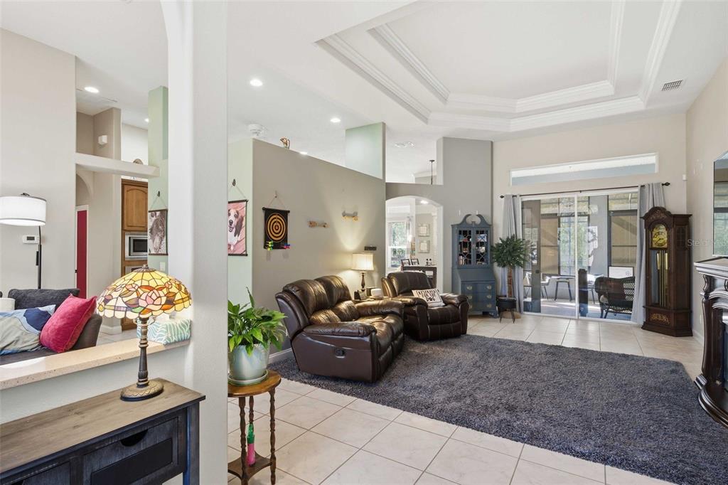 5580 South Kline Terrace Inverness, FL 34452 - Photo 8 of 55 a living room with furniture flowers and a chandelier