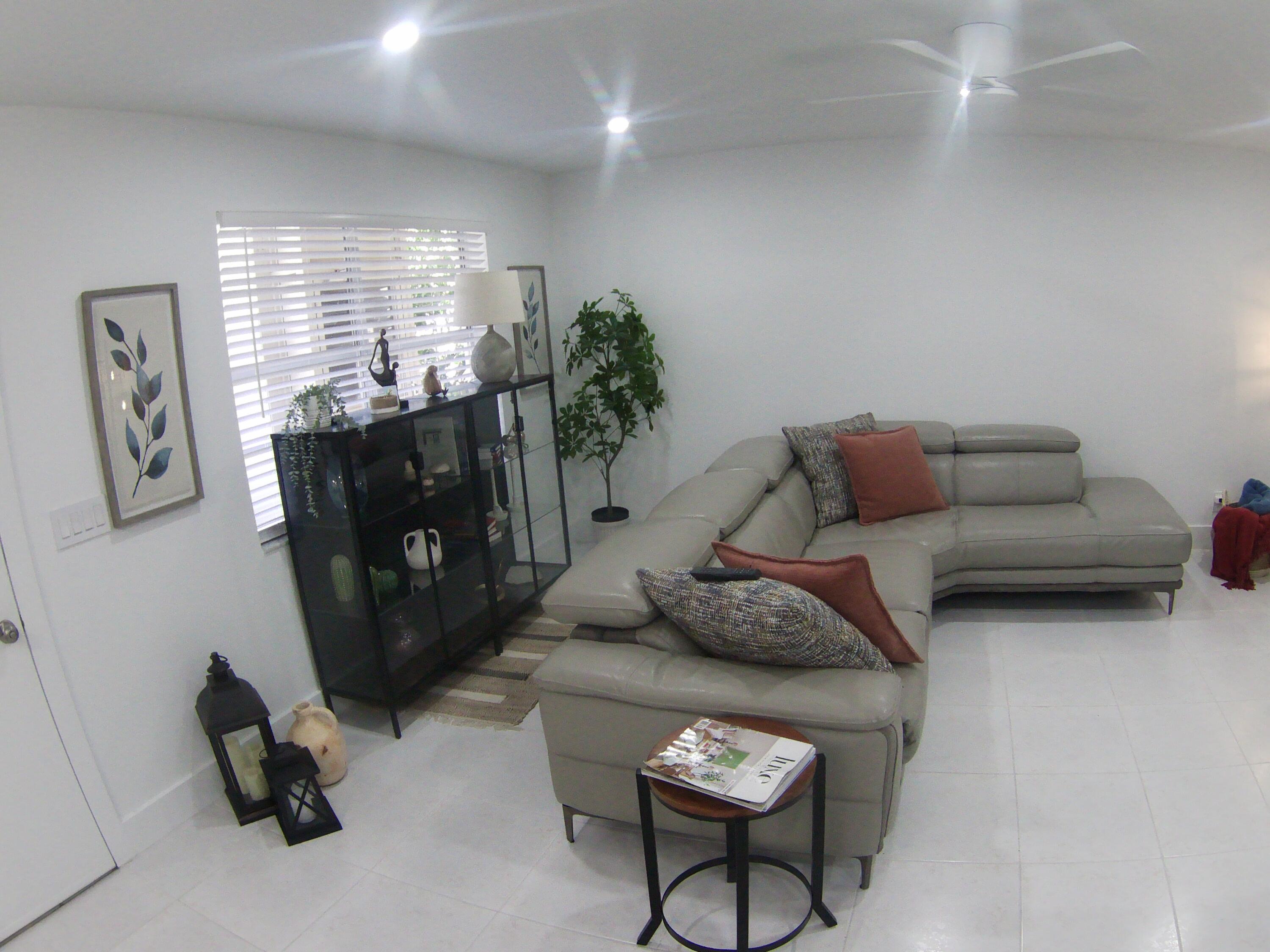 541 Normandy Lane Delray Beach, FL 33484 - Photo 5 of 23 a living room with furniture and a window