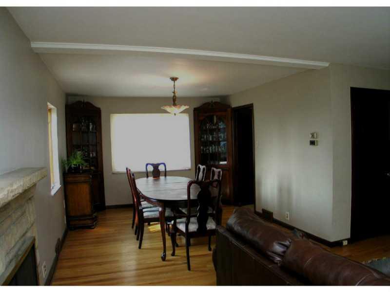 4542 Stilley Road Whitehall, PA 15227 - Photo 3 of 18 Dining Room. Wood & glass corner cupboards & lots of natural light. 12 x 11 Nice decorative stone fireplace in living room adjacent.