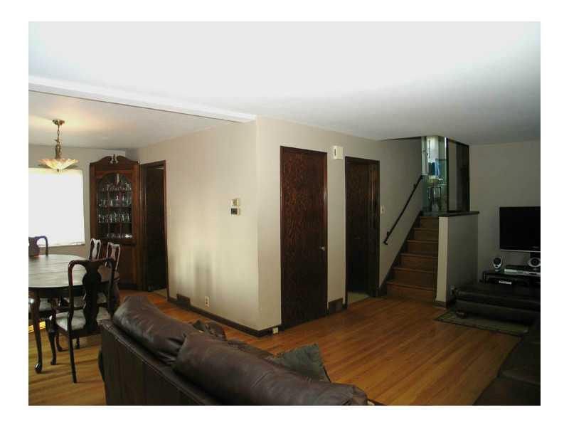 4542 Stilley Road Whitehall, PA 15227 - Photo 10 of 18 Living Room. Adjacent to kitchen, open plan, guest closet, refinished hardwood floors throughout, both full baths are only a half level away up or down.
