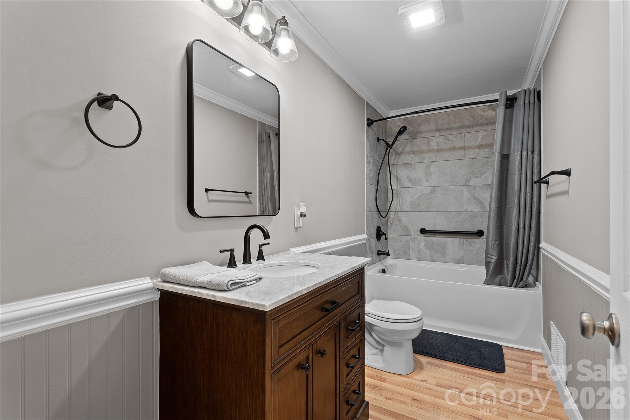 871 Saluda Road Chester, SC 29706 - Photo 26 of 46 a bathroom with a sink a toilet a mirror a vanity and shower