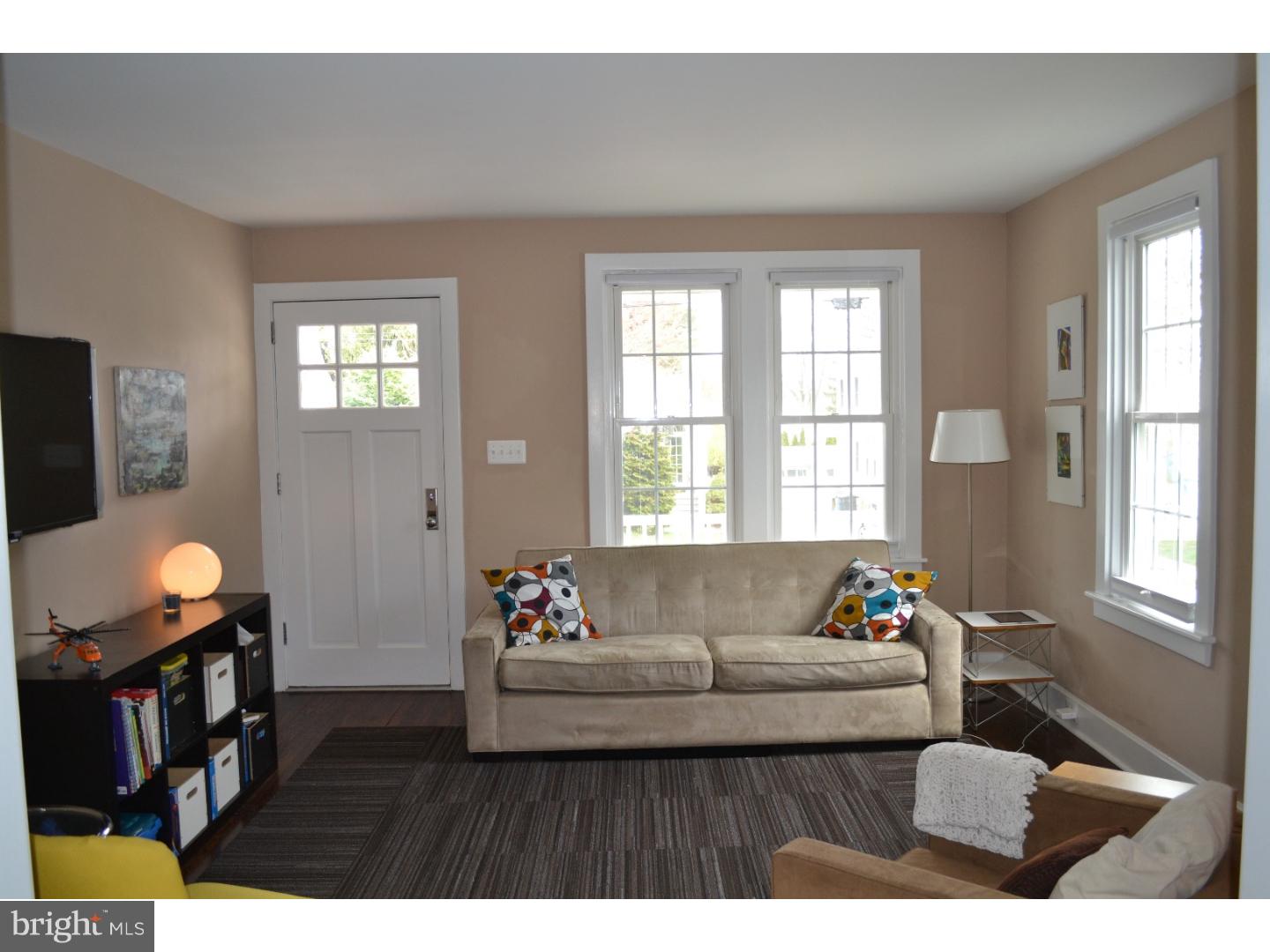 414 Righters Mill Road Gladwyne, PA 19035 - Photo 3 of 17 a living room with furniture and a flat screen tv