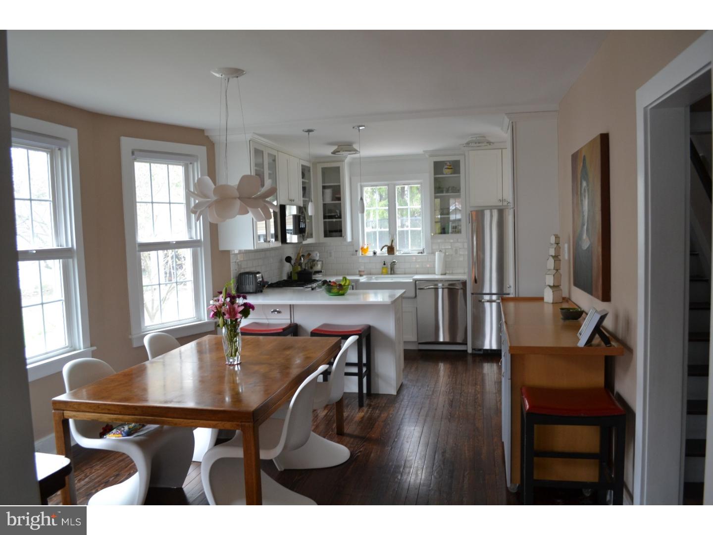 414 Righters Mill Road Gladwyne, PA 19035 - Photo 4 of 17 a dining hall with stainless steel appliances kitchen island granite countertop a dining table and chairs