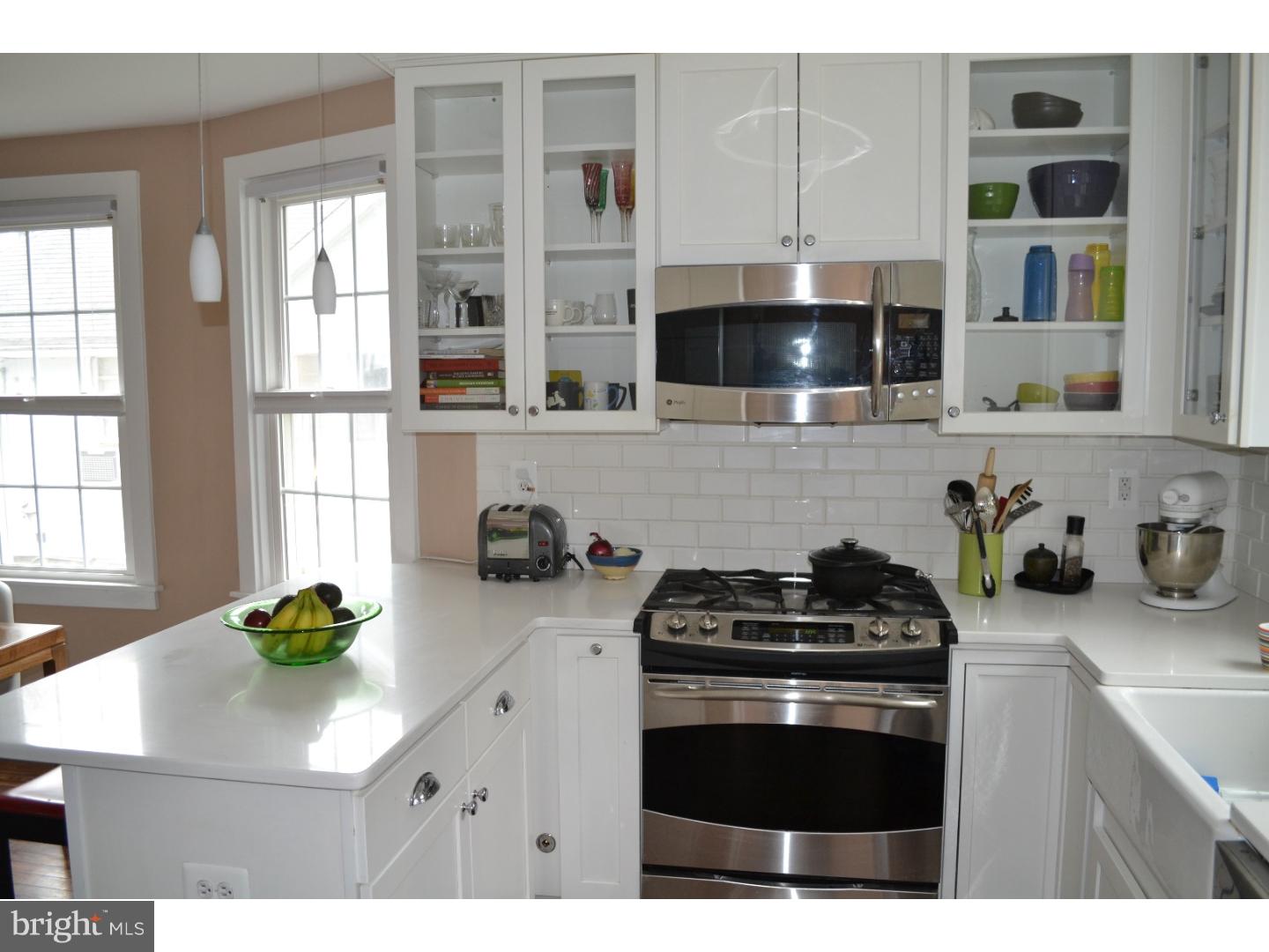 414 Righters Mill Road Gladwyne, PA 19035 - Photo 6 of 17 a kitchen with stainless steel appliances a stove a sink and a microwave
