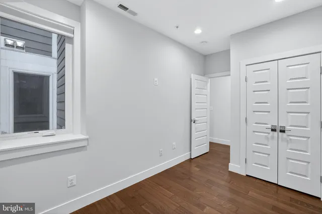 wooden floor with white walls