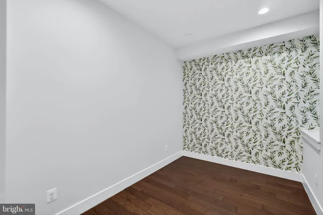 a view of a big room with wooden floor and shower