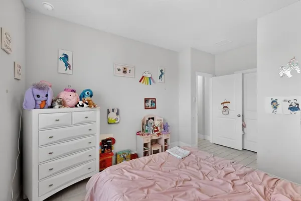 a bedroom with a bed and closet