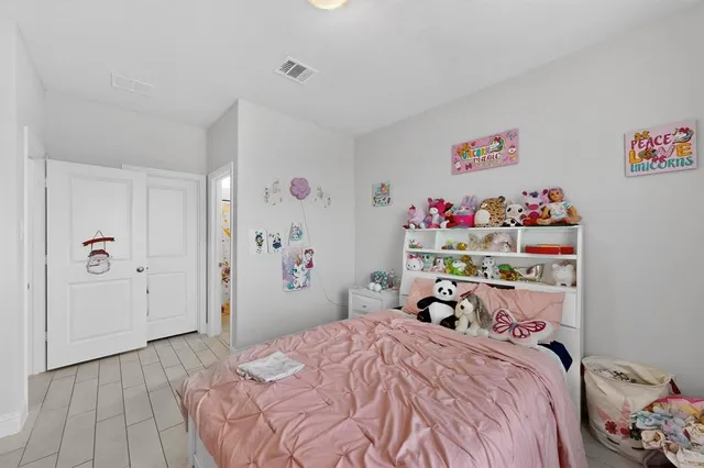 a bedroom with a bed and a closet