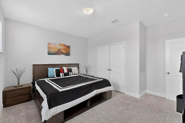 a bedroom with a bed and furniture