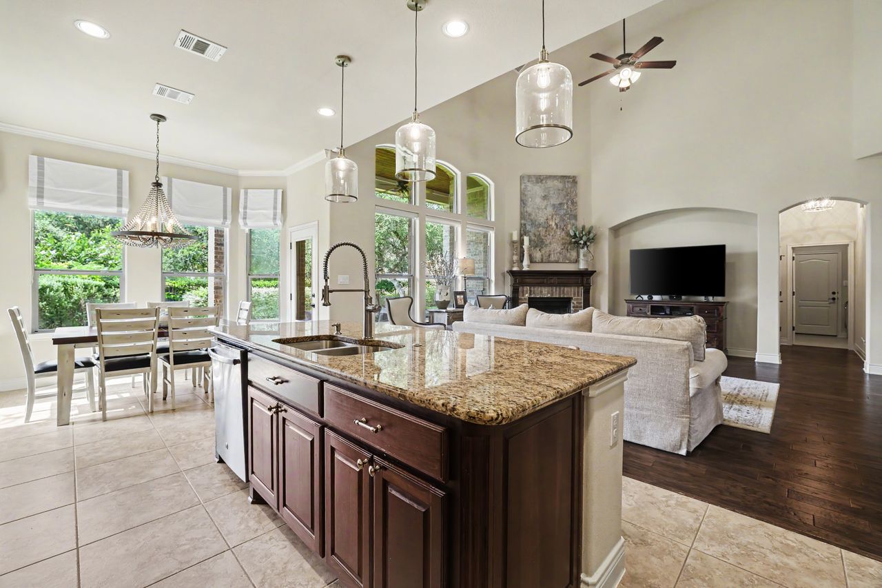 809 Prairie Dunes Drive Georgetown, TX 78628 - Photo 14 of 40 An open concept living area showcasing a spacious kitchen island and inviting dining space.