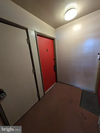 a view of a kitchen with a sink refrigerator and window