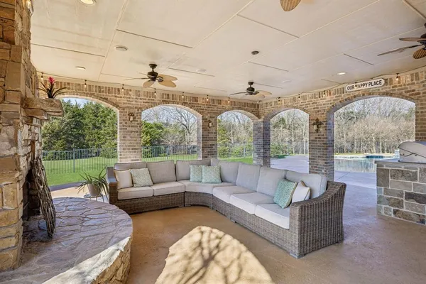 a view of a patio with couches table and chairs