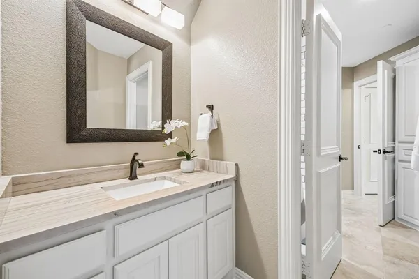 a bathroom with a sink and a mirror