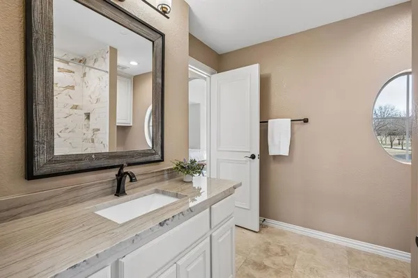 a bathroom with a sink and a mirror