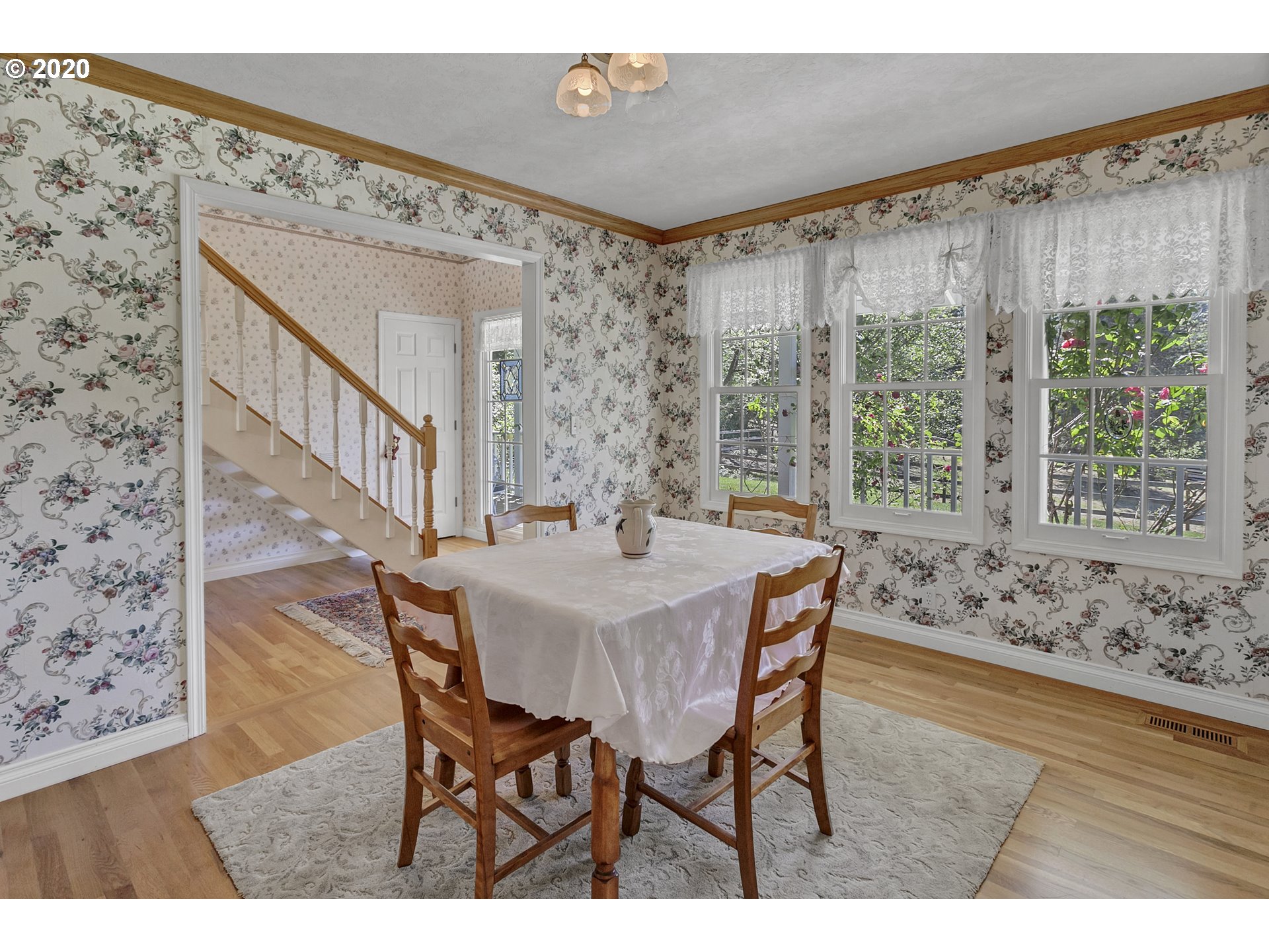 8888 Southeast Rodlun Road Damascus, OR 97089 - Photo 11 of 29 a view of a dining room with furniture and a large window