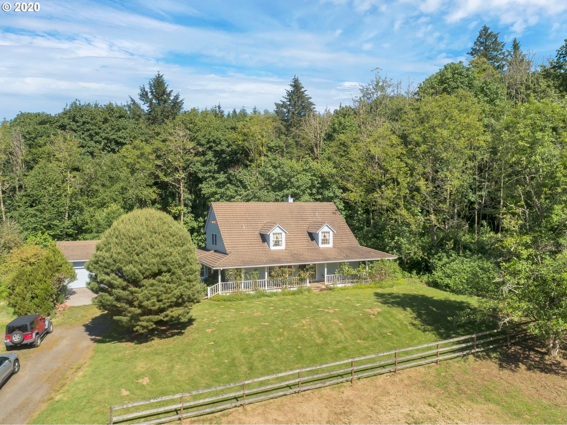 8888 Southeast Rodlun Road Damascus, OR 97089 - Photo 2 of 29 a view of a big yard with potted plants and large tree