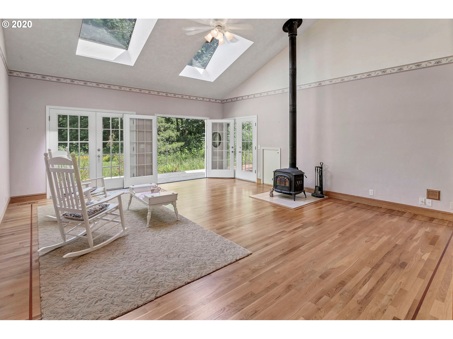 8888 Southeast Rodlun Road Damascus, OR 97089 - Photo 8 of 29 a living room with furniture and a large window