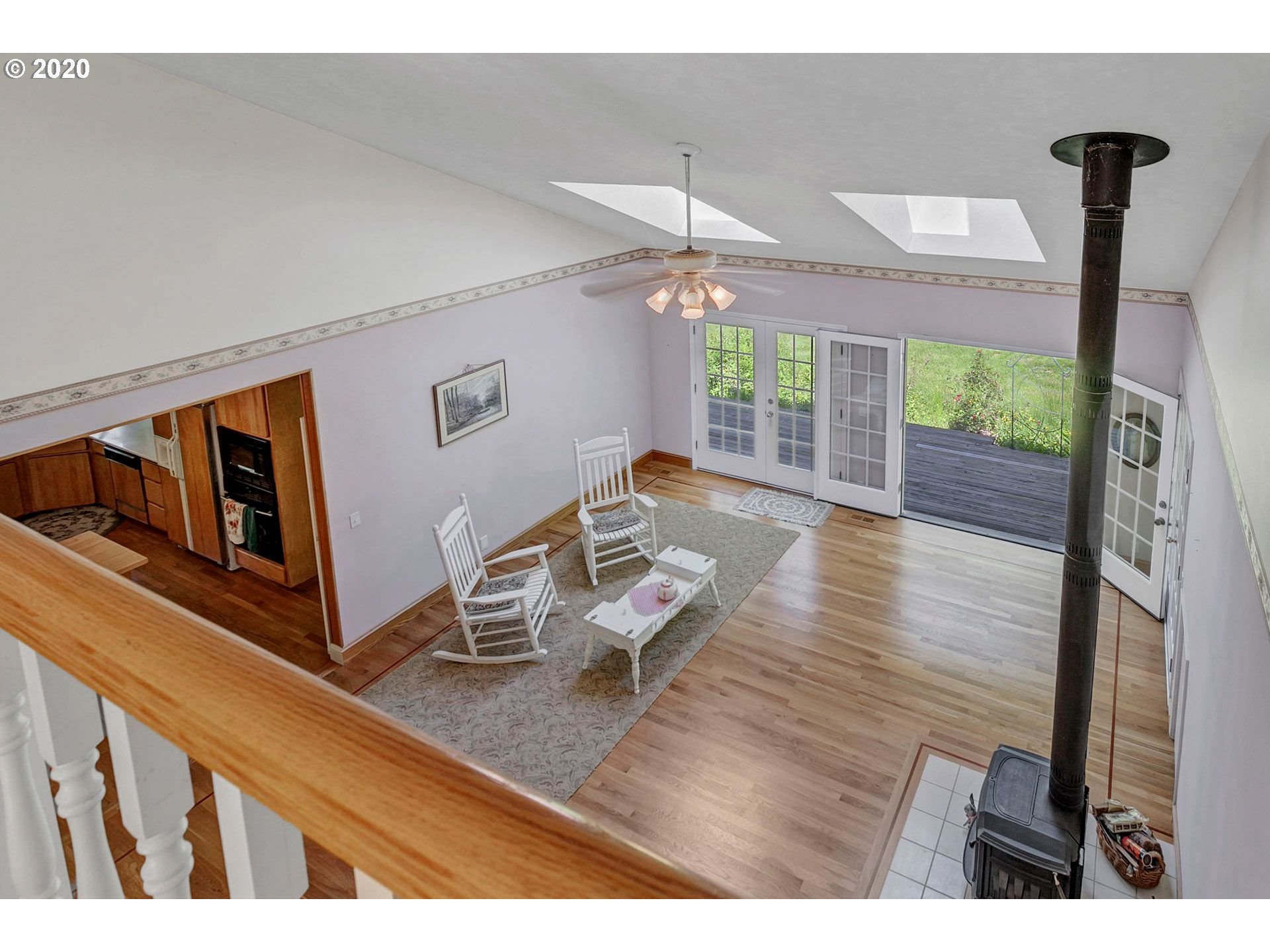 8888 Southeast Rodlun Road Damascus, OR 97089 - Photo 9 of 29 a living room with furniture large window and wooden floor