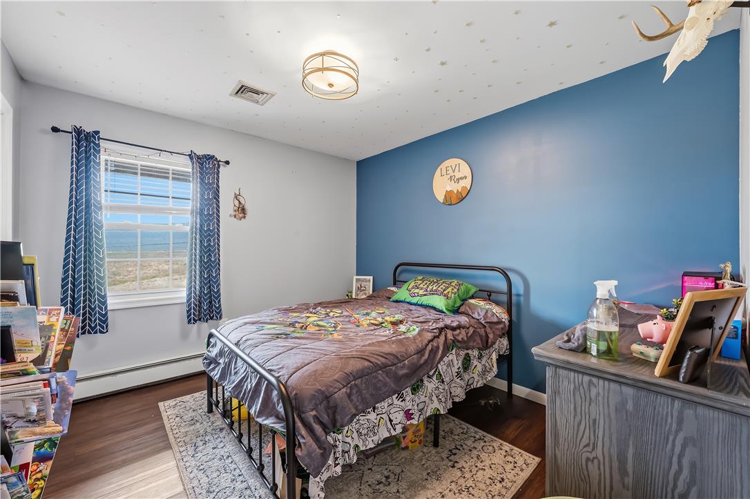 9868 Stagecoach Road Kempton, PA 19529 - Photo 11 of 17 Well-lit sleeping quarters with a window overlooking a tranquil outdoor view.
