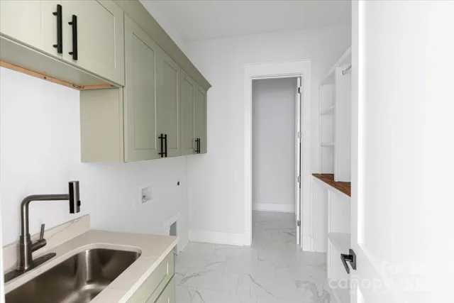 a aerial view of a house with a yard table and chairs