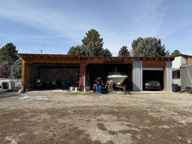 415 East Maple Street Mapleton, UT 84664 - Photo 9 of 19 View of building featuring a carport and storage area.