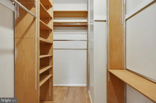 a view of a patio with a table and chairs under an umbrella