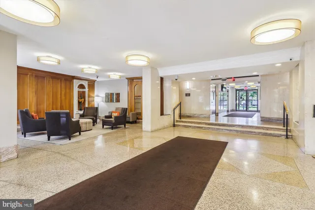 a view of a hallway with wooden floor and entryway