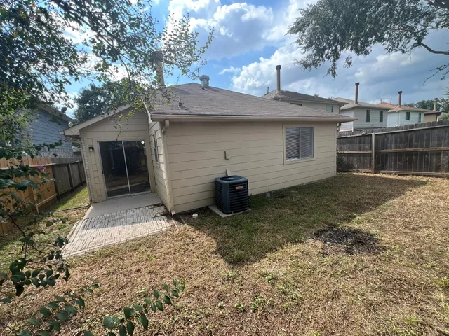 a view of a house with a yard and garage