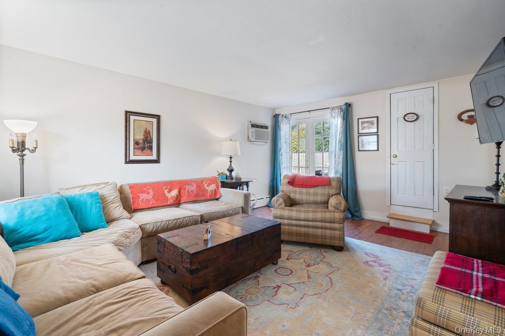 217-19 39th Avenue Queens, NY 11361 - Photo 11 of 38 a living room with furniture and a couch