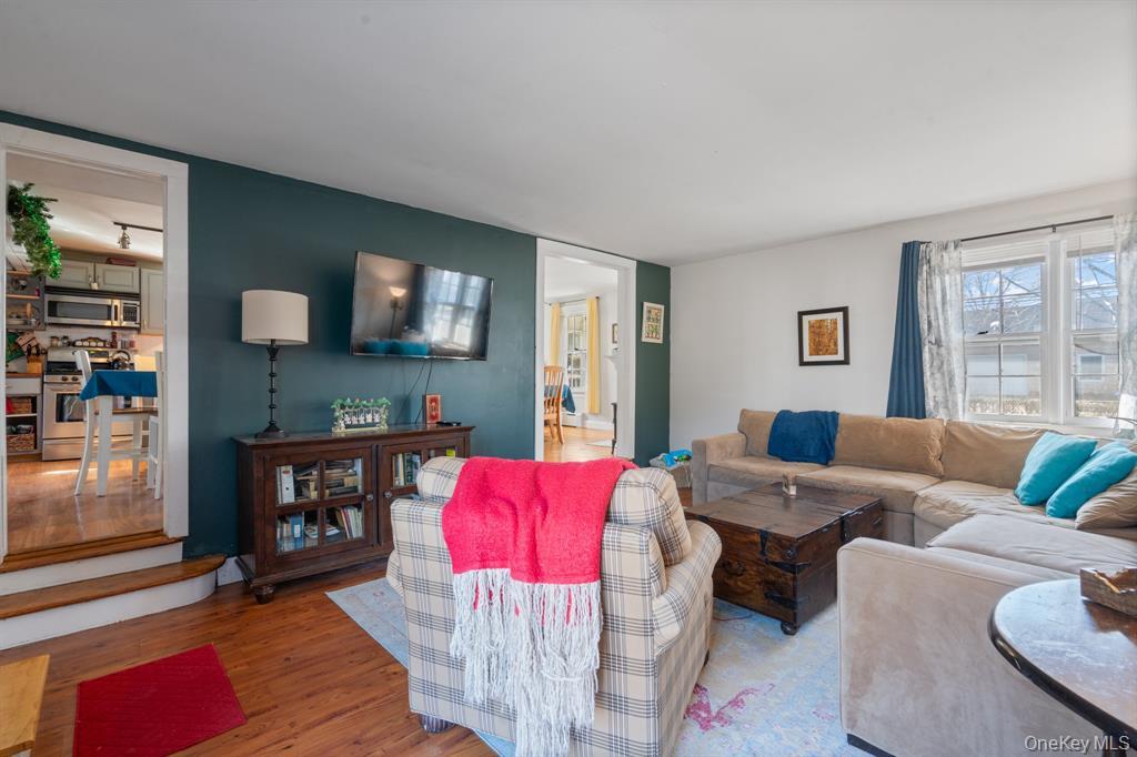 217-19 39th Avenue Queens, NY 11361 - Photo 12 of 38 a living room with furniture and a fireplace
