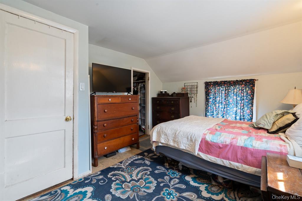 217-19 39th Avenue Queens, NY 11361 - Photo 16 of 38 a bedroom with a bed and wooden floor