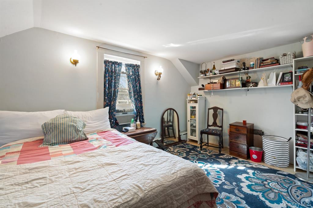 217-19 39th Avenue Queens, NY 11361 - Photo 17 of 38 a bedroom with bed and a closet