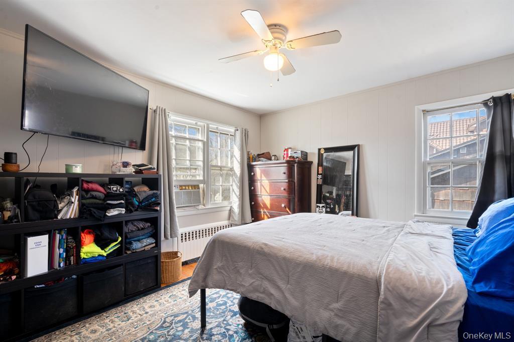 217-19 39th Avenue Queens, NY 11361 - Photo 18 of 38 a bedroom with a bed and a walk in closet