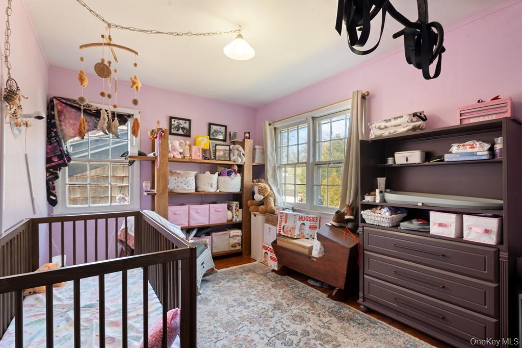 217-19 39th Avenue Queens, NY 11361 - Photo 20 of 38 a bedroom with furniture and a window