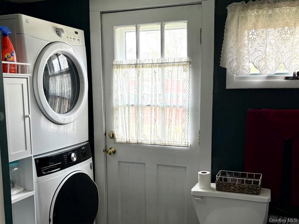 217-19 39th Avenue Queens, NY 11361 - Photo 23 of 38 a view of a kitchen with washer and dryer