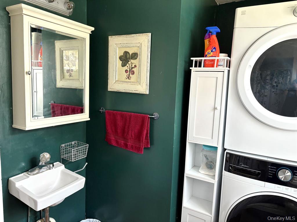 217-19 39th Avenue Queens, NY 11361 - Photo 24 of 38 a utility room with dryer and washer