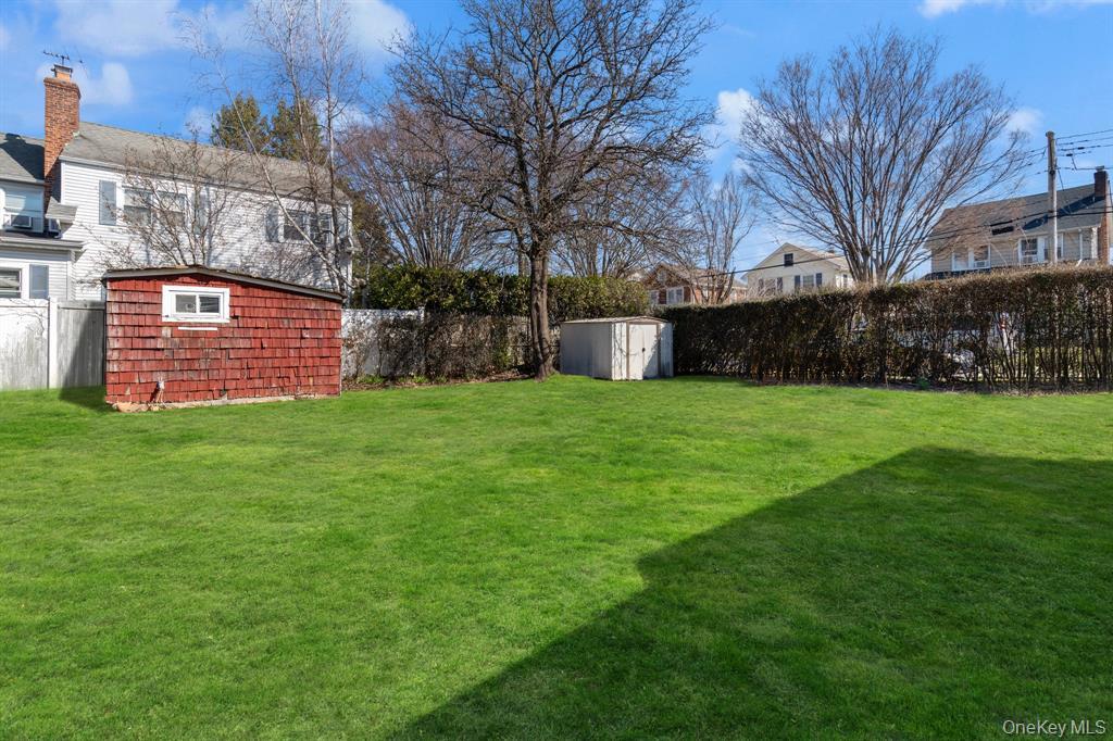 217-19 39th Avenue Queens, NY 11361 - Photo 25 of 38 a view of a backyard with large trees